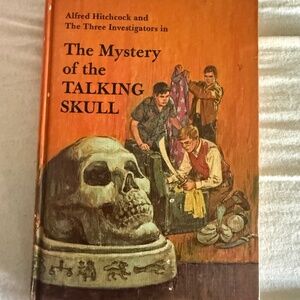 Three investigators talking skull 11 Alfred Hitchcock